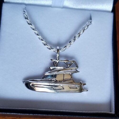 Silver necklace with a detailed pendant of a helicopter.