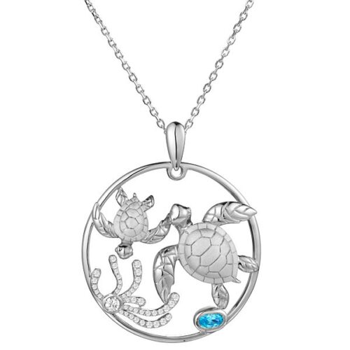Silver turtle pendant necklace with aquatic design.