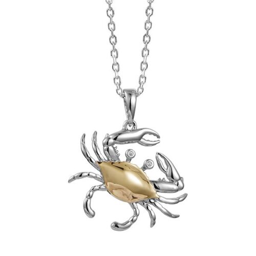 Silver crab pendant with golden center on a chain necklace.
