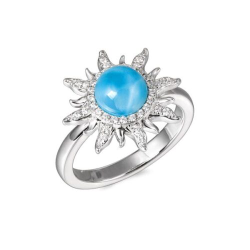 Silver ring with a blue gemstone and sunburst design.