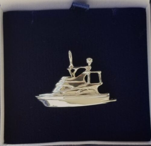 Abstract beige spiral sculpture on a dark background.