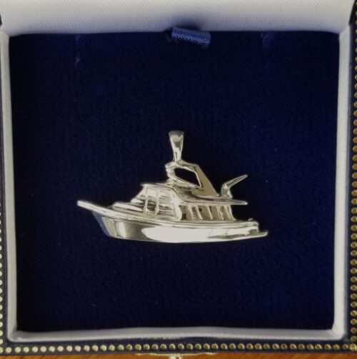 Silver charm shaped like a detailed boat with a flag.