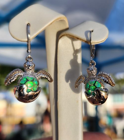 Colorful turtle-shaped earrings with turquoise and silver details.