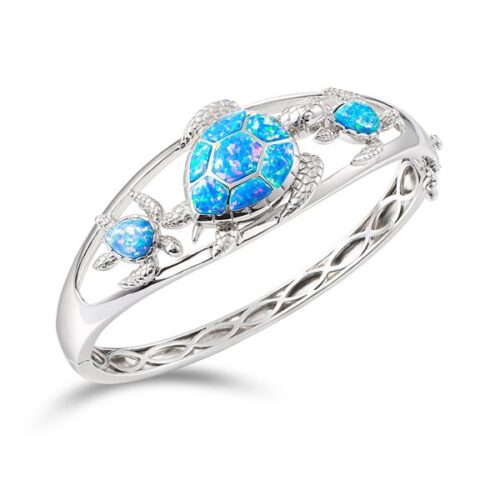 Elegant silver ring with three blue opal stones.