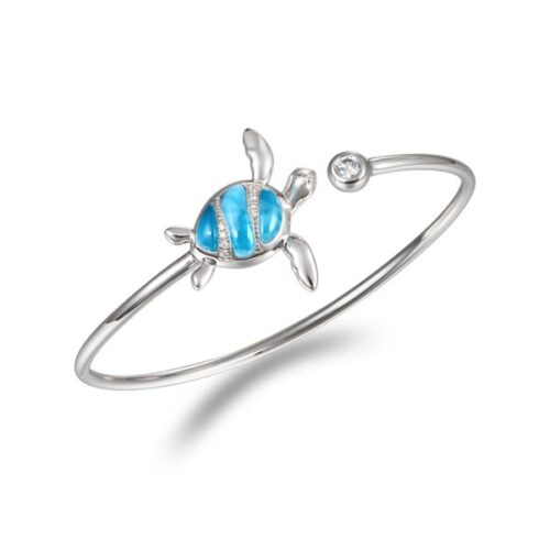 Silver bracelet with a blue turtle charm.